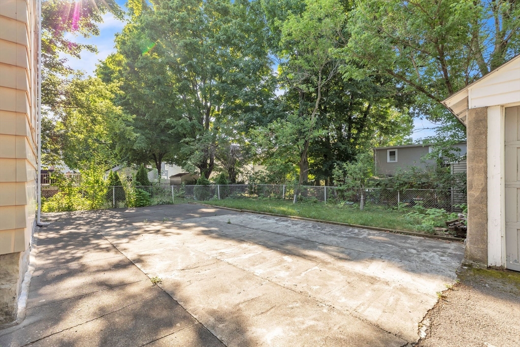 49 Laurel Street Watertown, MA 02472 - Photo 35 of 42 a view of a yard with plants and trees