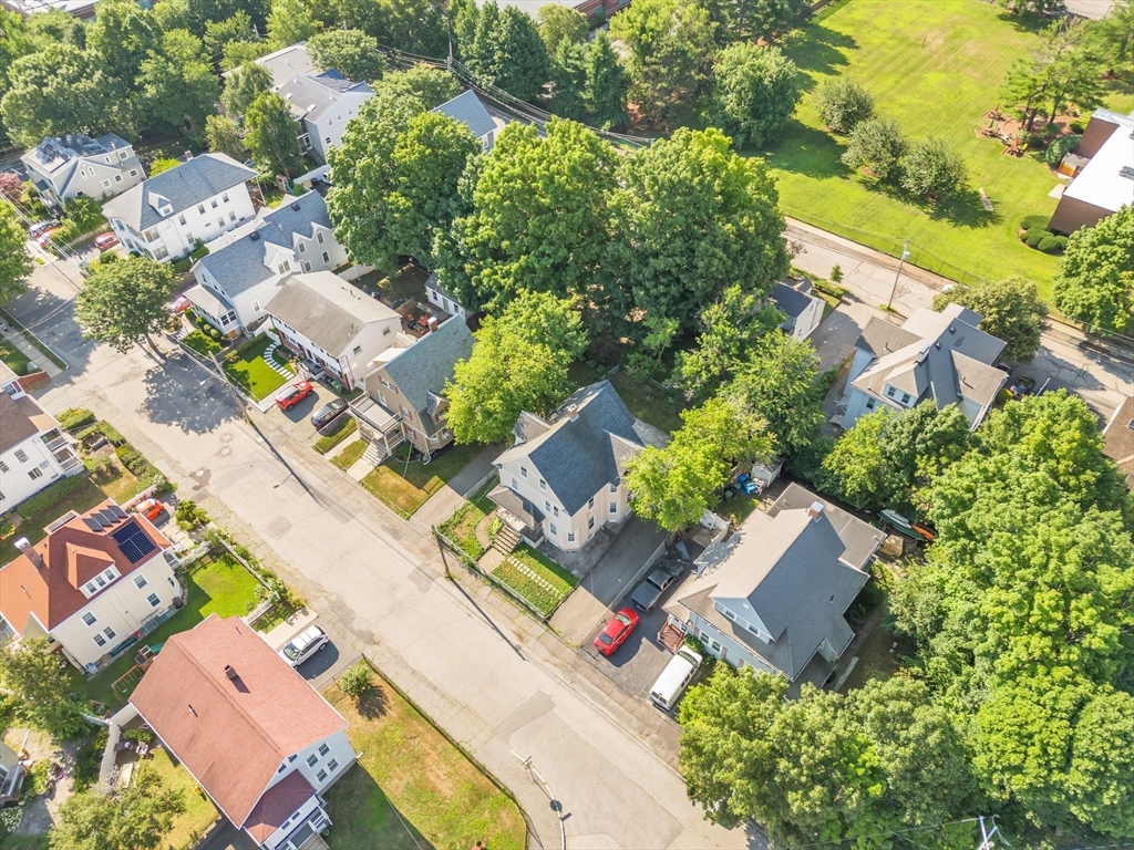 49 Laurel Street Watertown, MA 02472 - Photo 37 of 42 an aerial view of residential house with outdoor space and parking