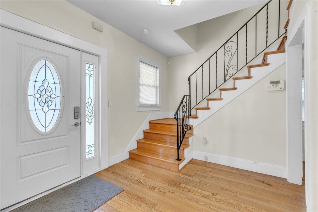 49 Laurel Street Watertown, MA 02472 - Photo 9 of 42 a view of entryway with wooden floor