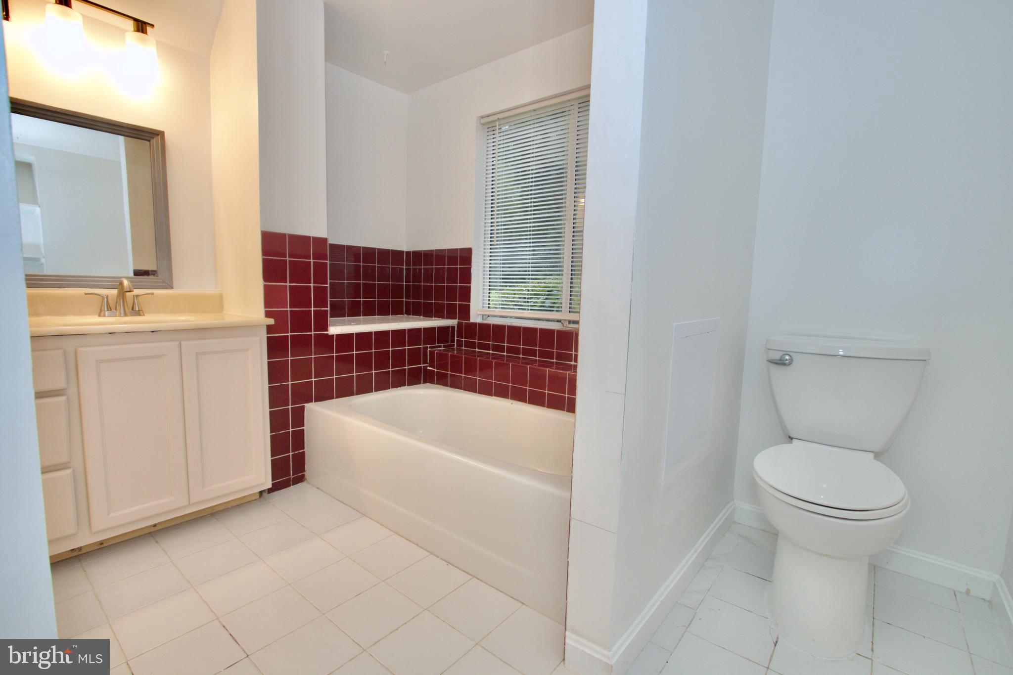9120 Bowie Road Nanjemoy, MD 20662 - Photo 15 of 28 a bathroom with a sink a toilet and bathtub