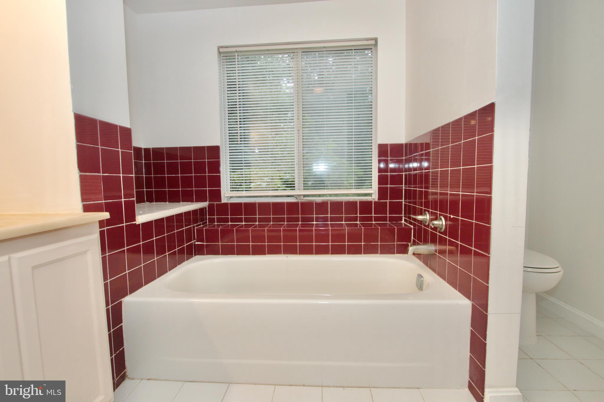 9120 Bowie Road Nanjemoy, MD 20662 - Photo 16 of 28 a bathroom with a bathtub and shower