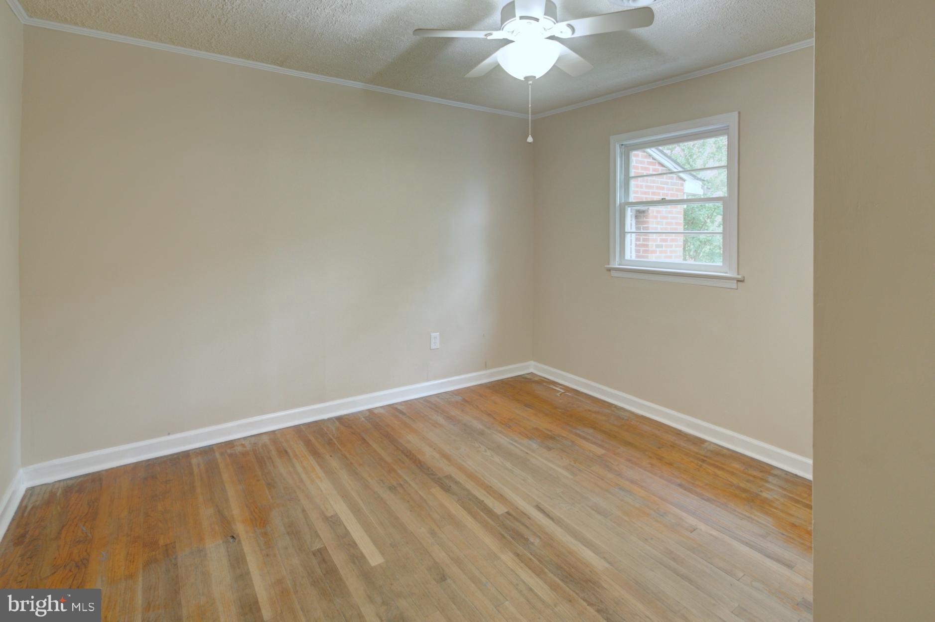 9120 Bowie Road Nanjemoy, MD 20662 - Photo 21 of 28 wooden floor in an empty room with a window