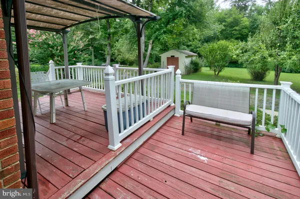 a view of deck with two chairs and wooden floor