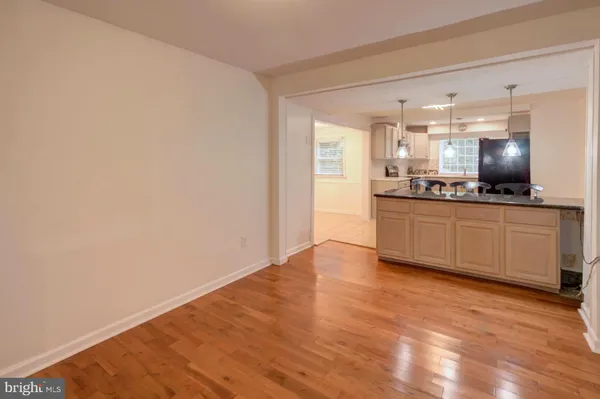 a kitchen with granite countertop a sink and cabinets