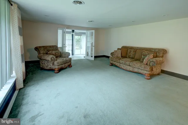 a living room with furniture and a couch