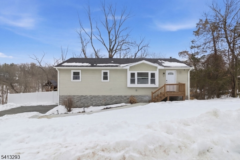 3 Gardenia Road Vernon, NJ 07418 - Photo 1 of 22 a view of a house with snow on the road