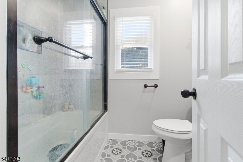 3 Gardenia Road Vernon, NJ 07418 - Photo 15 of 22 a bathroom with a toilet and a shower