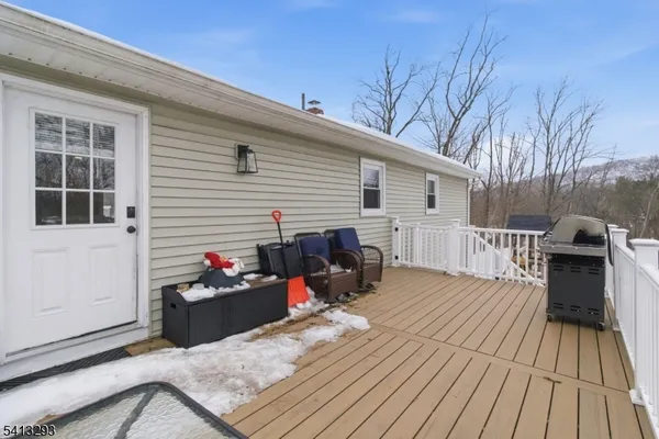 a view of a deck with furniture and wooden floor
