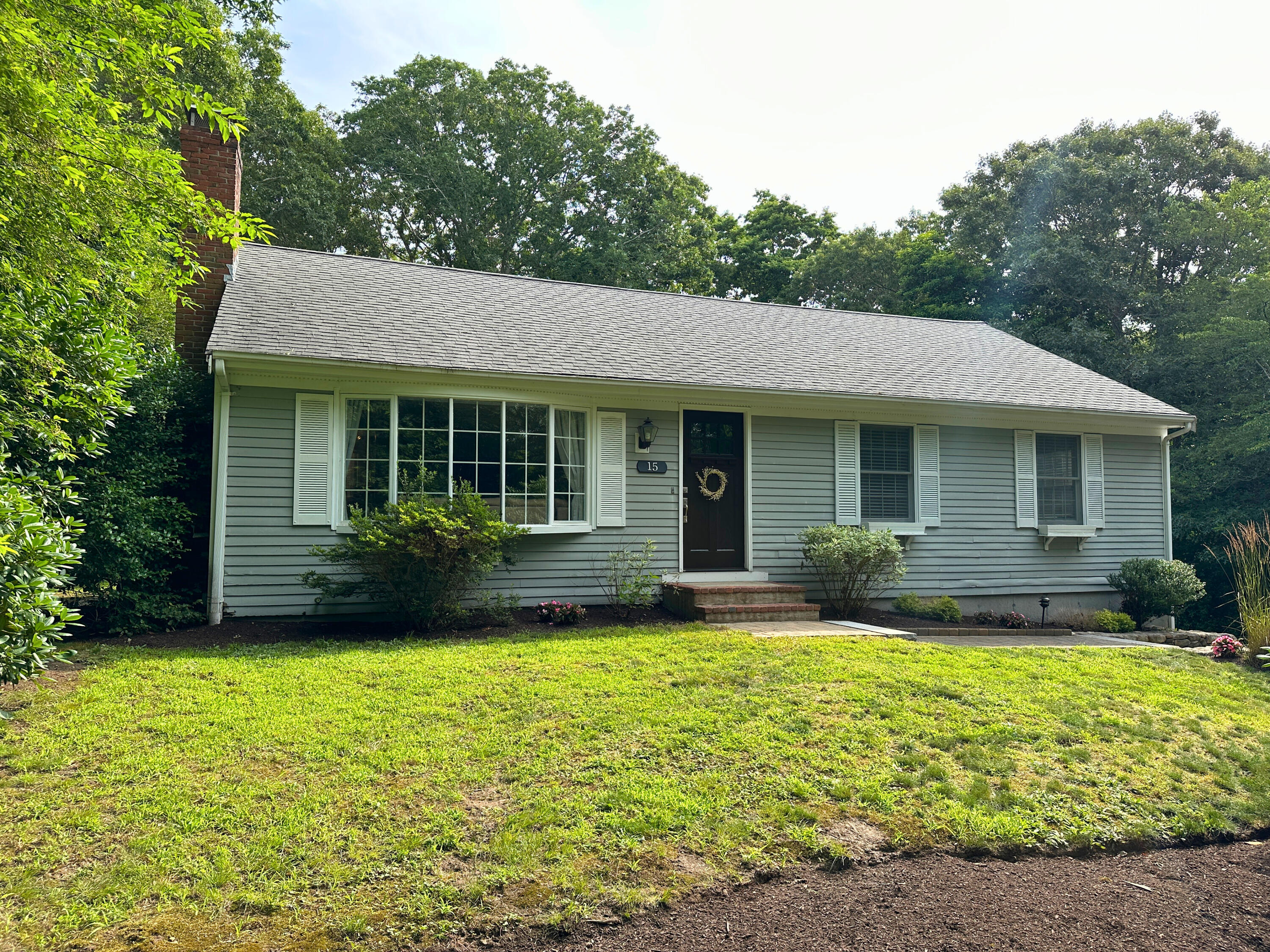 15 Surrey Lane Sandwich, MA 02563 - Photo 1 of 51 a view of a house with backyard sitting area and garden