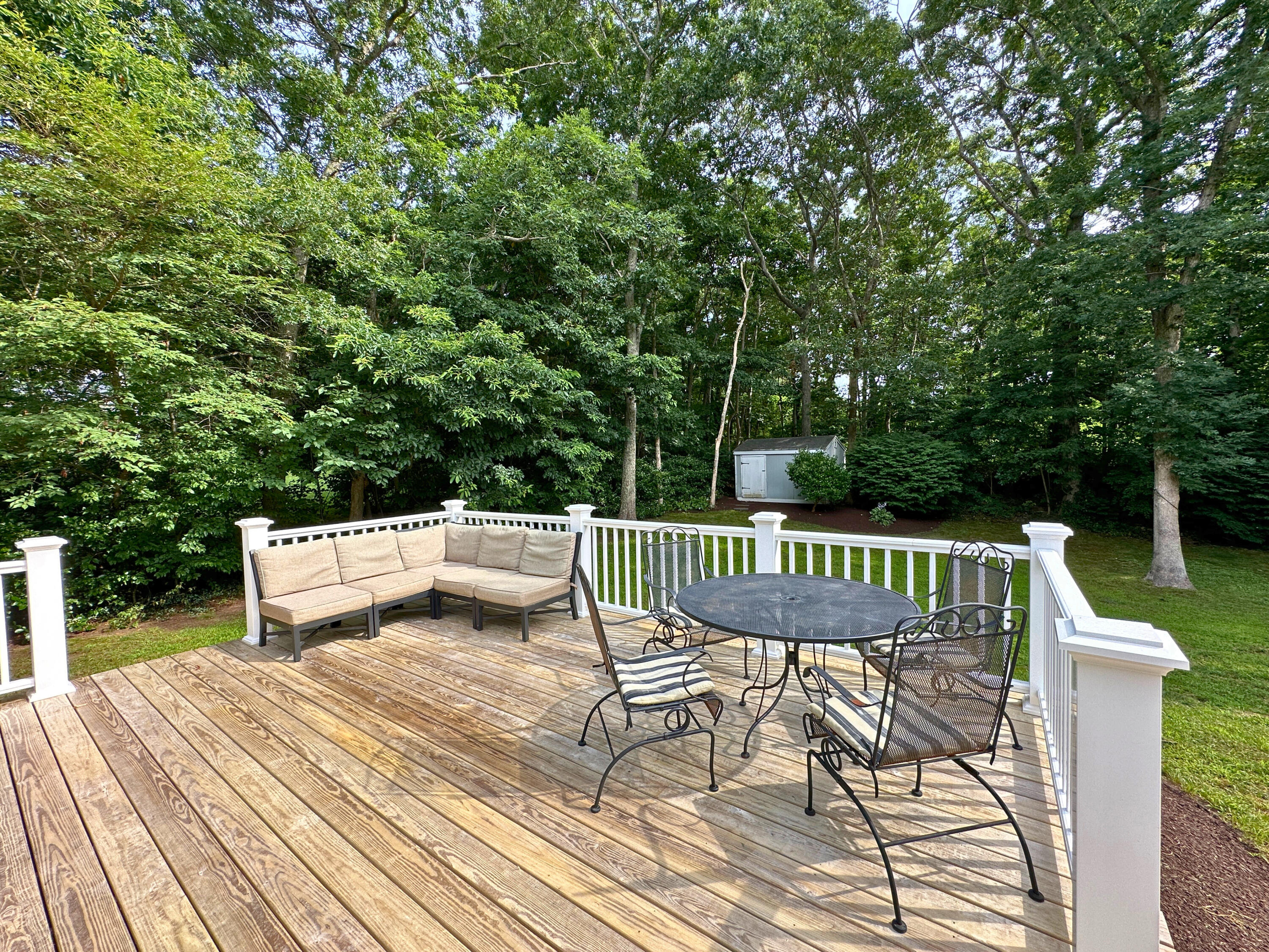 15 Surrey Lane Sandwich, MA 02563 - Photo 11 of 51 a view of balcony with wooden floor and outdoor seating