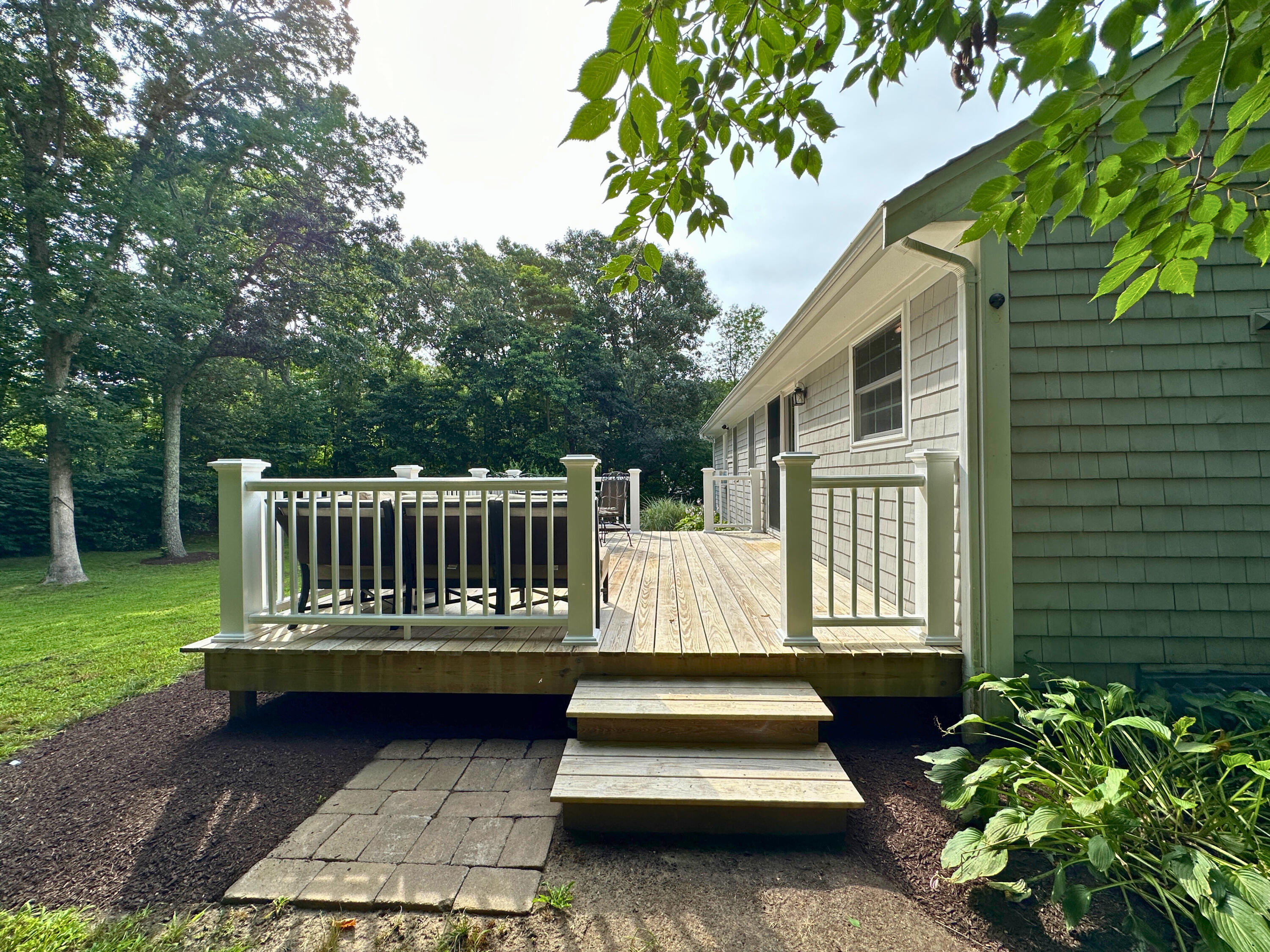 15 Surrey Lane Sandwich, MA 02563 - Photo 13 of 51 a view of a back yard of a house with a patio