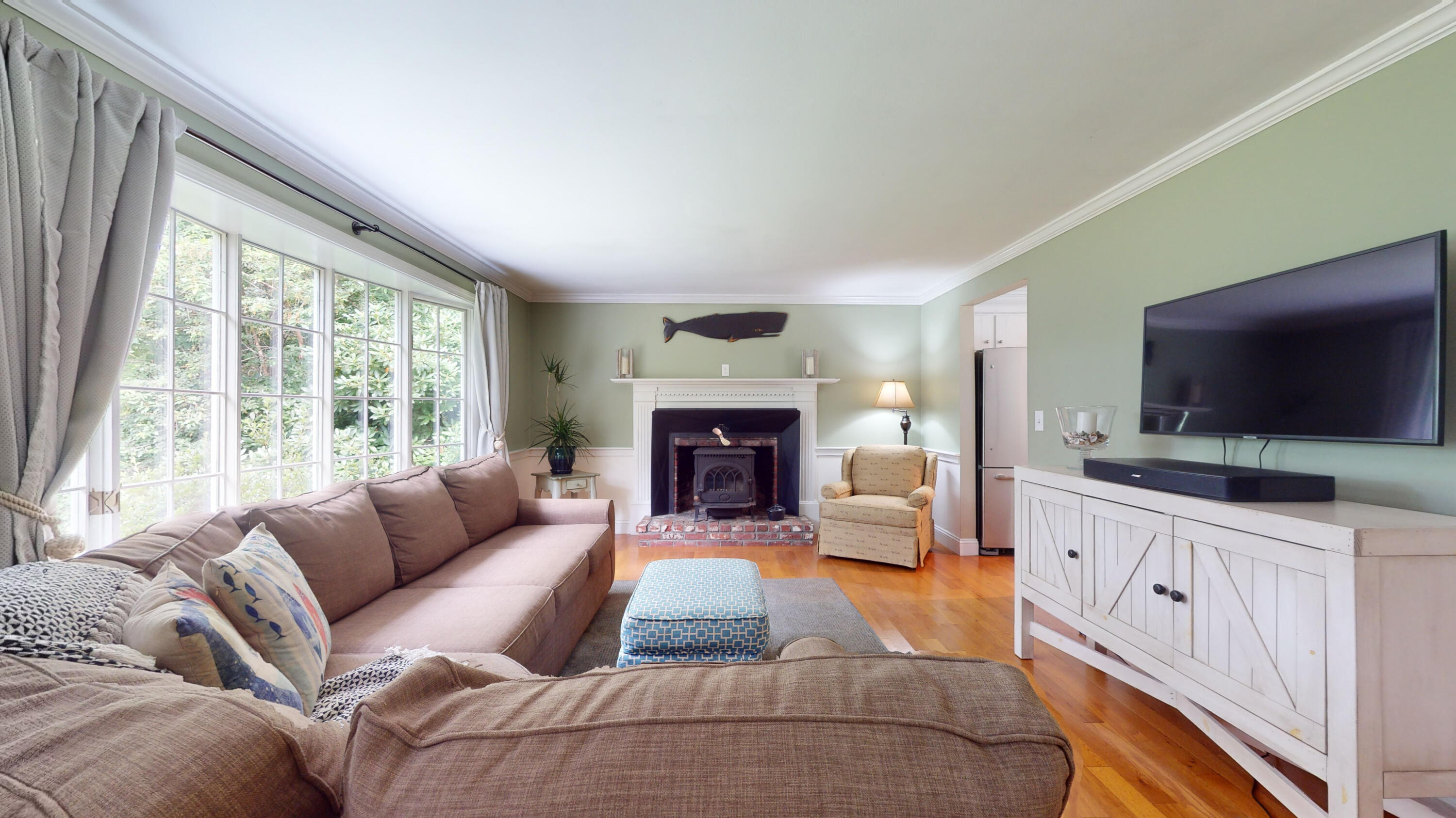 15 Surrey Lane Sandwich, MA 02563 - Photo 21 of 51 a living room with furniture a flat screen tv and a fireplace