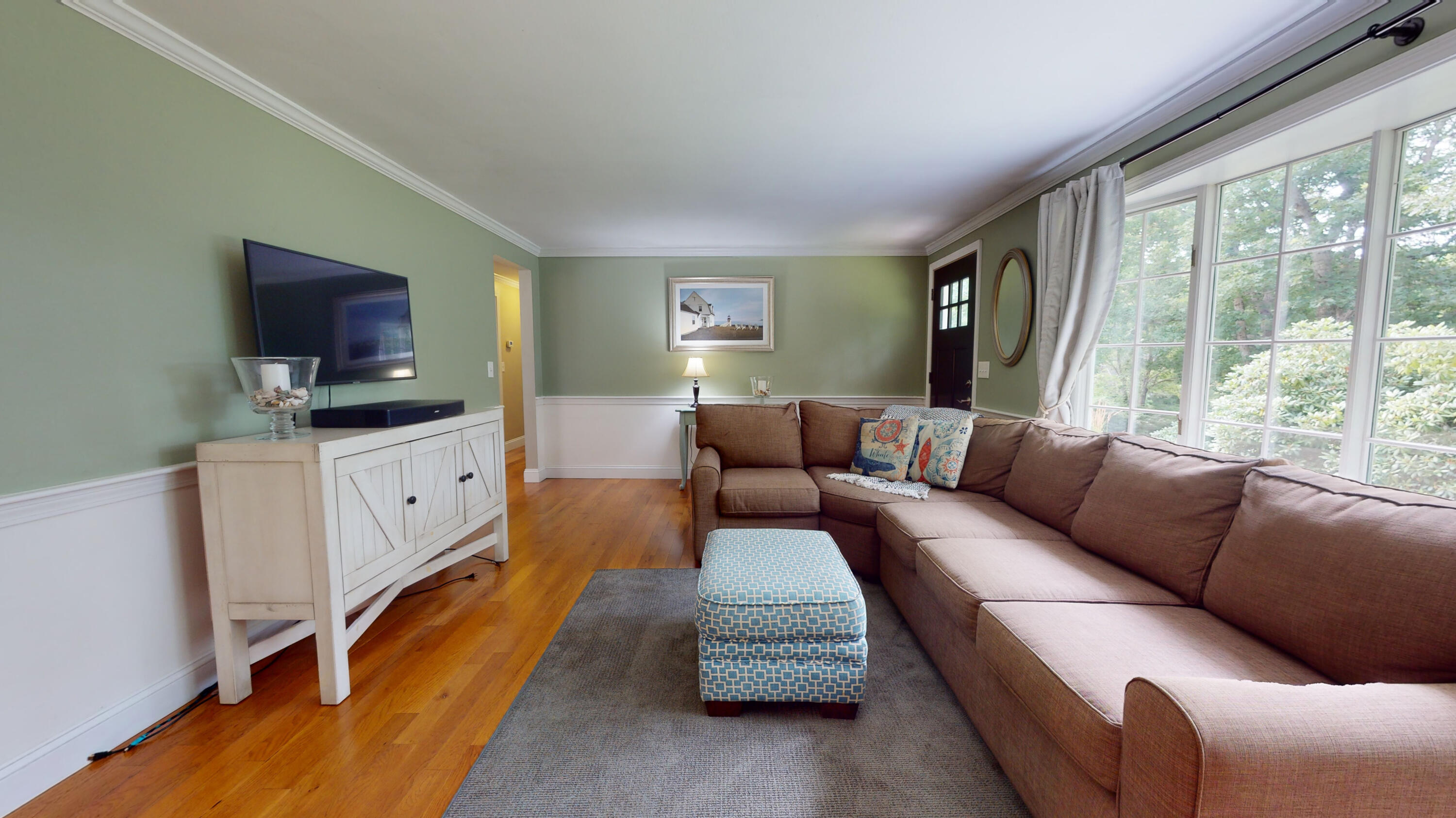 15 Surrey Lane Sandwich, MA 02563 - Photo 24 of 51 a living room with furniture and a flat screen tv