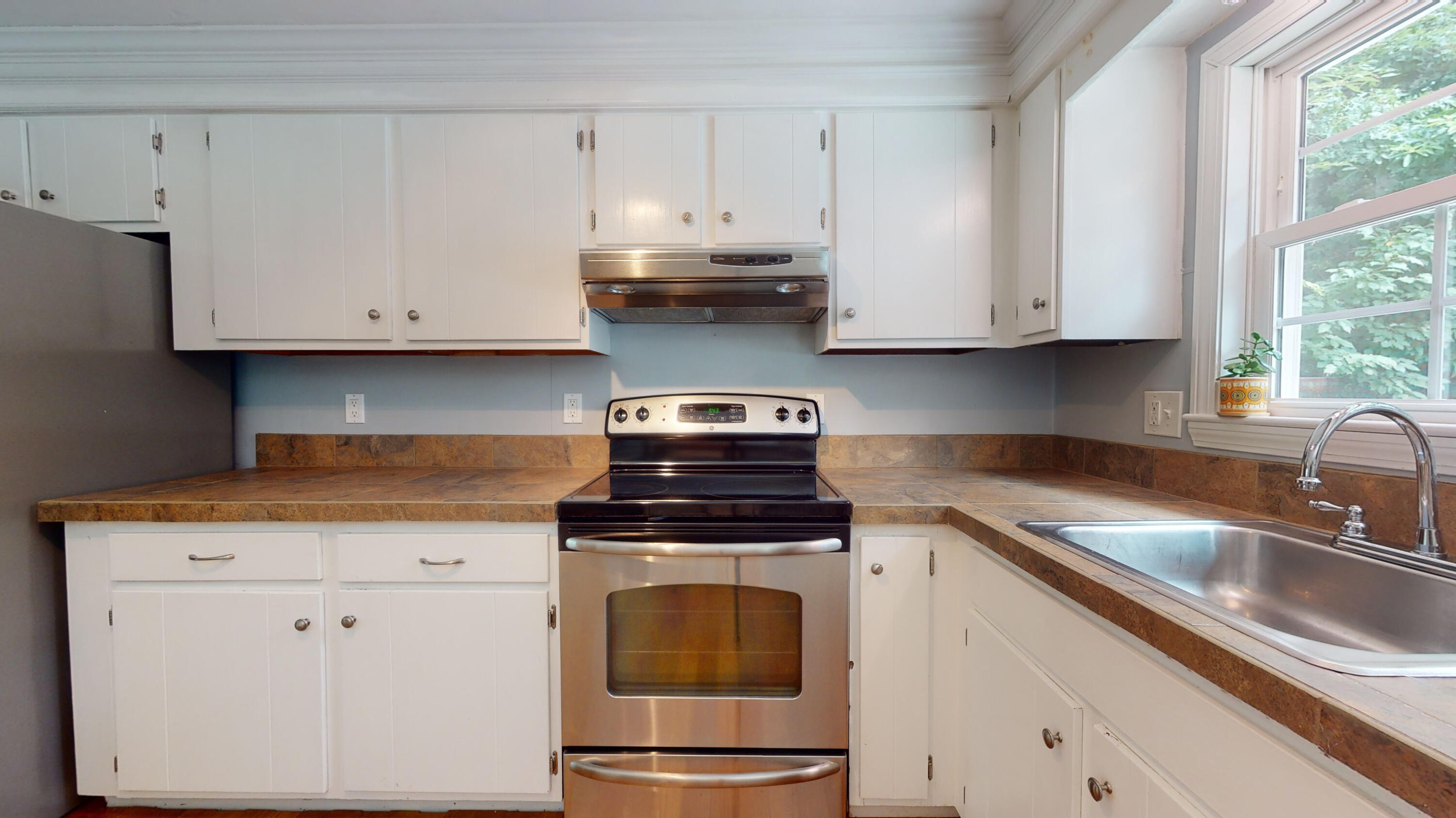 15 Surrey Lane Sandwich, MA 02563 - Photo 27 of 51 a kitchen with granite countertop white cabinets and white appliances