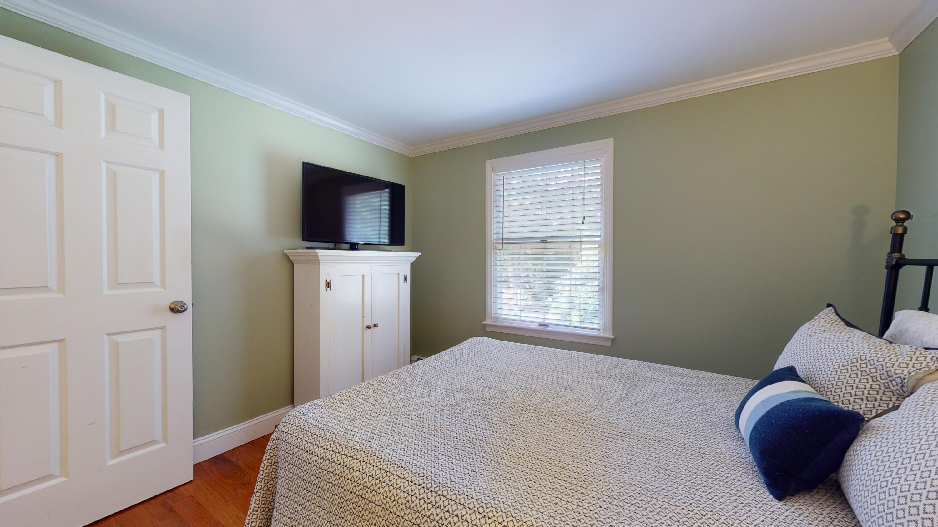 15 Surrey Lane Sandwich, MA 02563 - Photo 46 of 51 a bedroom with a bed and flat screen tv