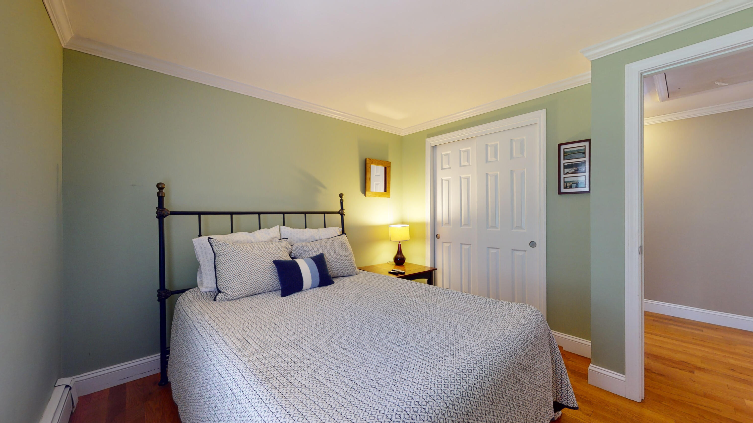 15 Surrey Lane Sandwich, MA 02563 - Photo 47 of 51 a bedroom with a bed and wooden floor