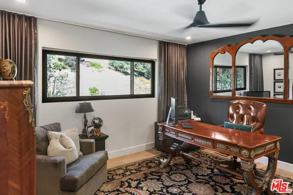 a room with furniture and a large window