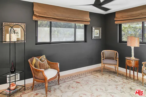 a bedroom with a bed and chair