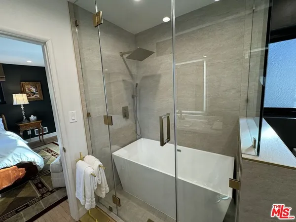 a bathroom with a bathtub and a sink