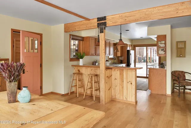 a living room with furniture and a book shelf