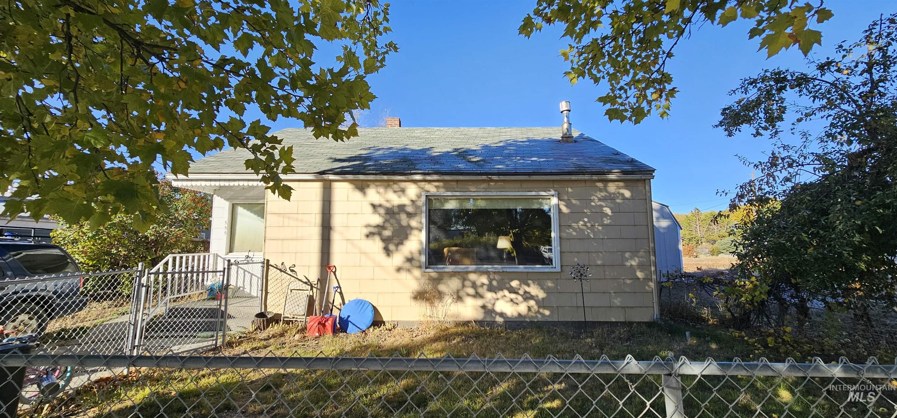 555 15th Street Vale, OR 97918 - Photo 26 of 27 View of property exterior featuring a chimney and a shingled roof
