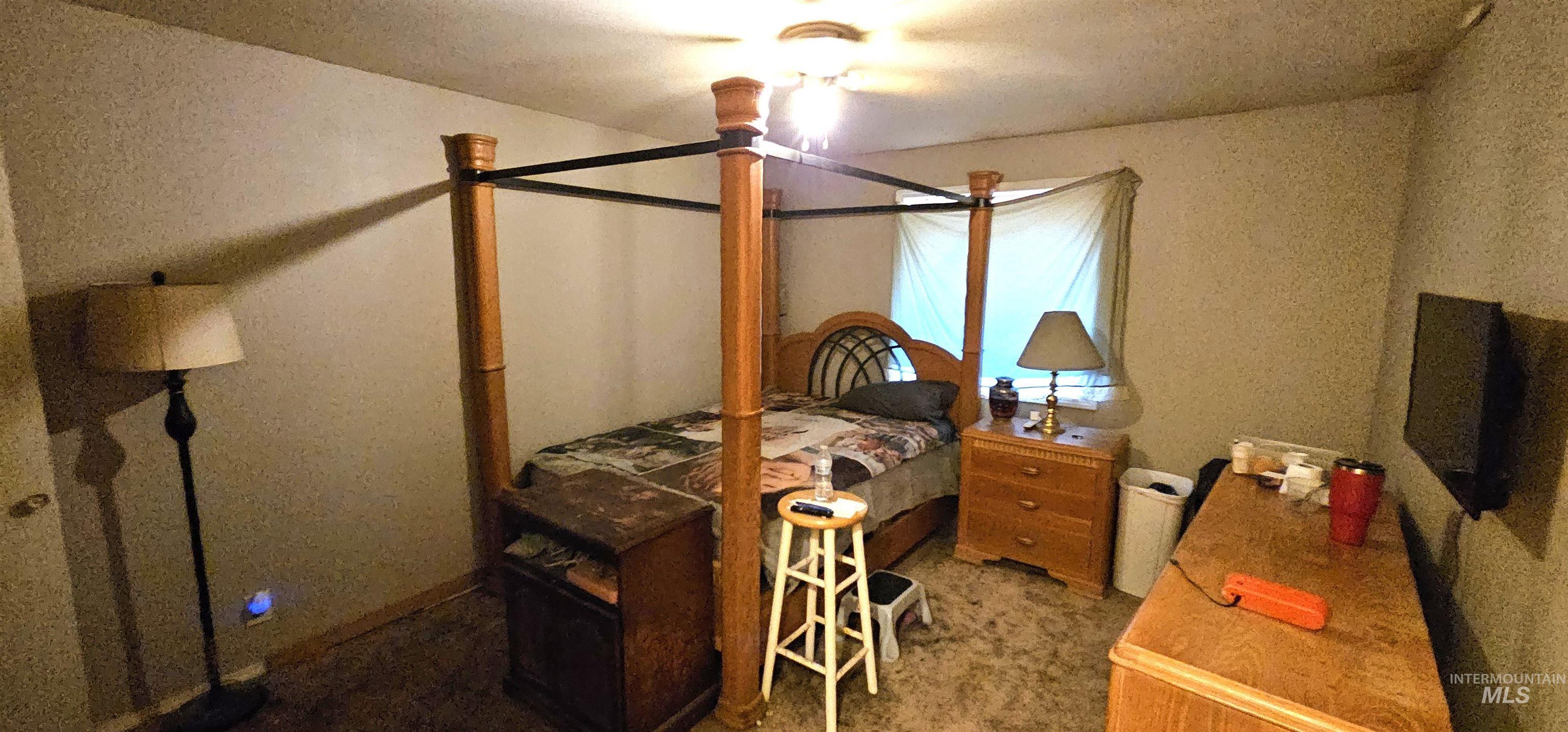555 15th Street Vale, OR 97918 - Photo 10 of 27 Carpeted bedroom with a textured ceiling