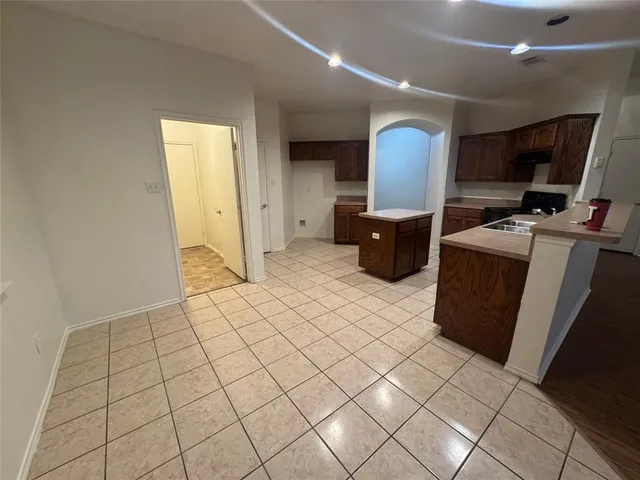 a view of a workspace with furniture