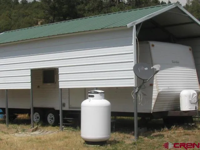 a view of a balcony with wooden floor