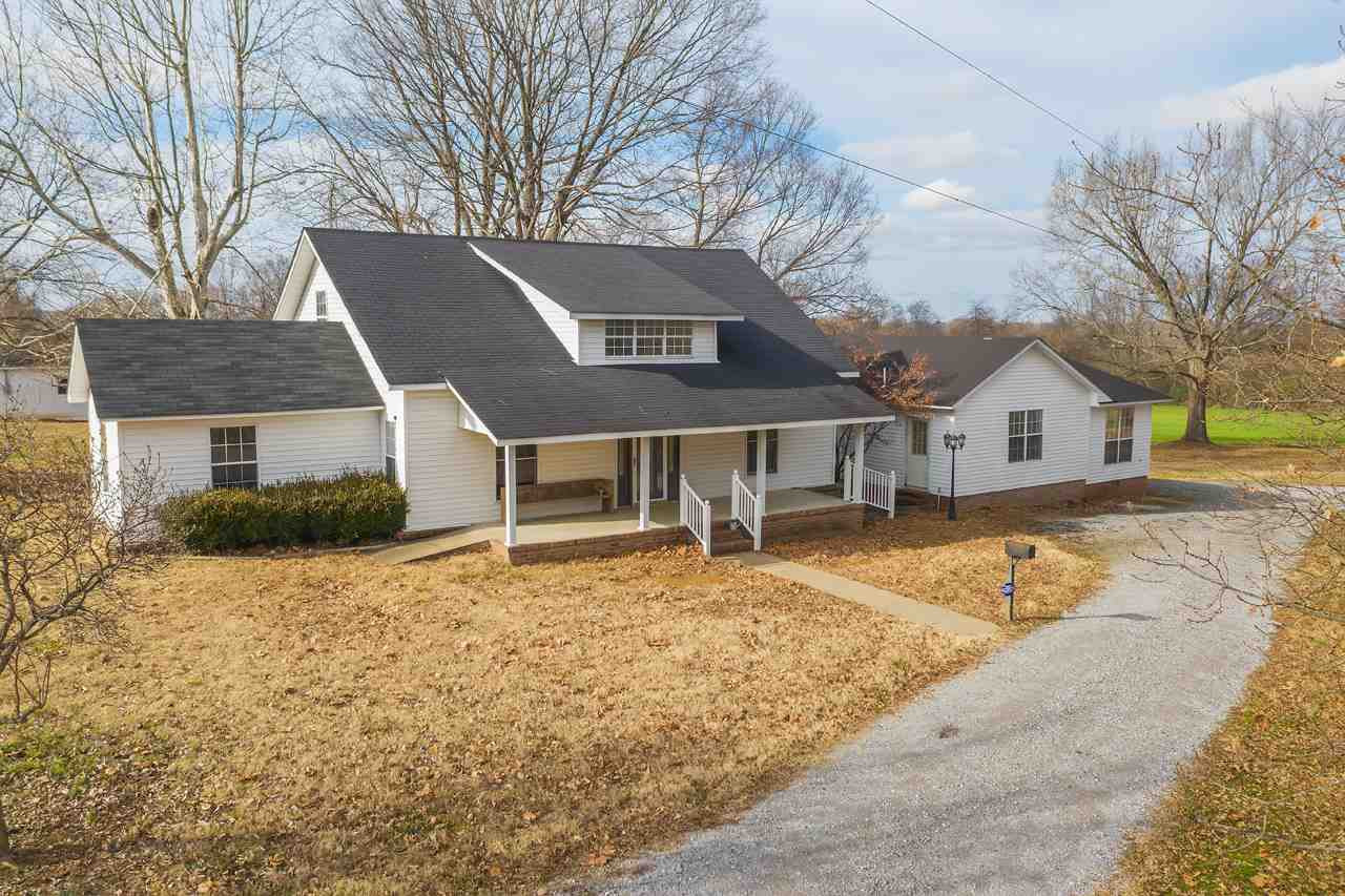 143 Tyson Store Road Kenton, TN 38233 - Photo 1 of 1 a house with trees in the background