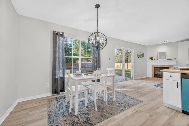 a view of a dining room with furniture window and outside view