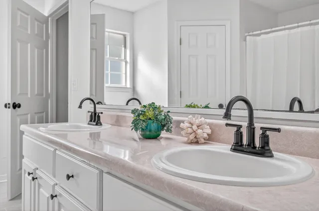 a large white room with wooden floor
