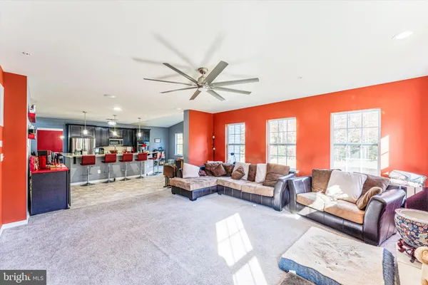 a view of a hallway with workspace and stairs