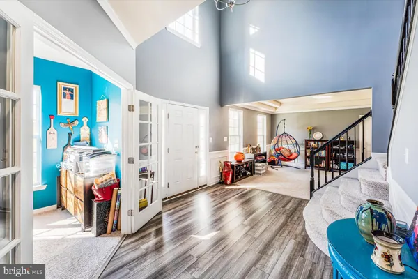 a view of walk in closet with clothes