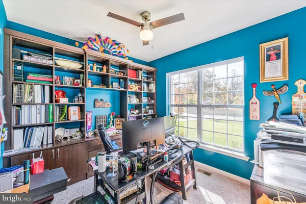 a bathroom with a toilet and a shower curtain