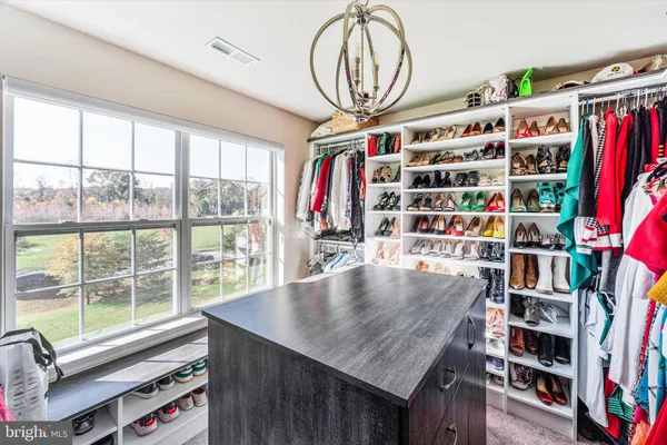 a bedroom with furniture and a flat screen tv