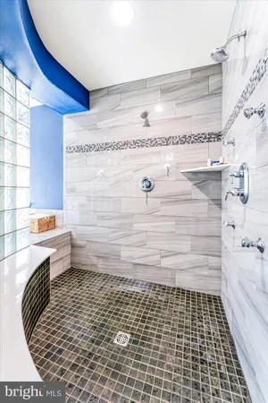 a front view of a building with a garden