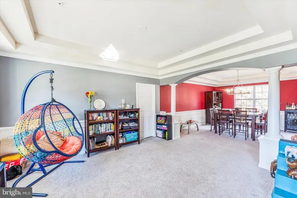 a dining room with furniture and window