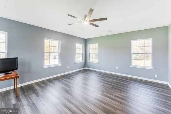 a kitchen with stainless steel appliances granite countertop a refrigerator and a stove