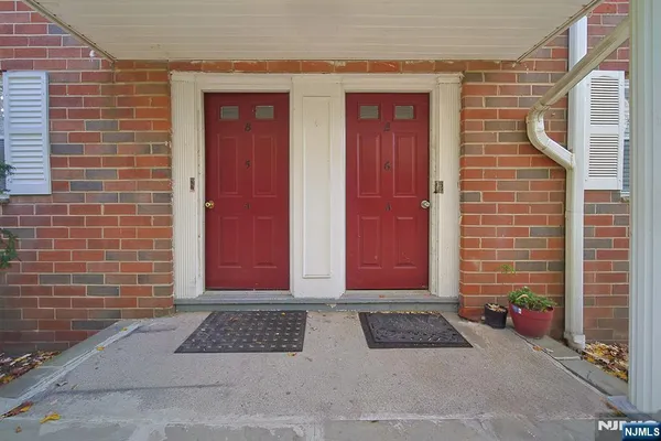 a view of a door and a window