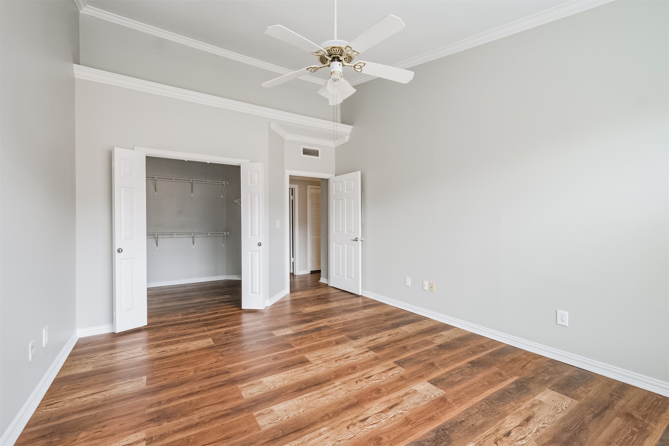 2111 Welch Street, Unit B304 Houston, TX 77019 - Photo 19 of 37 wooden floor in an empty room with a window