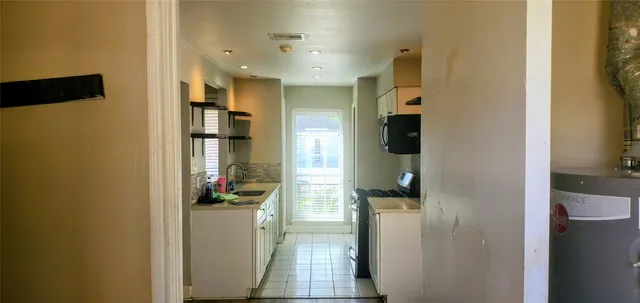 a bathroom with a sink and mirror