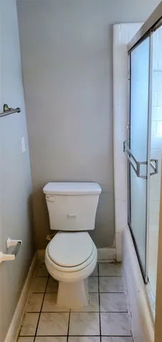 a white toilet sitting next to a bathroom sink