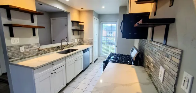 a bathroom with a double vanity sink and mirror