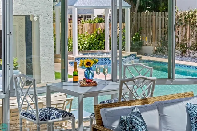 swimming pool view with outdoor seating
