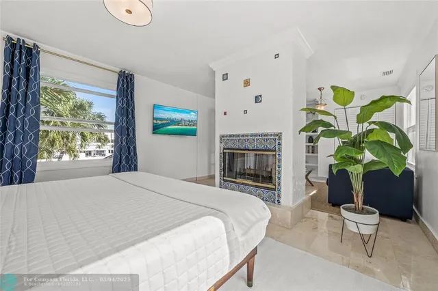 a bedroom with furniture and a window