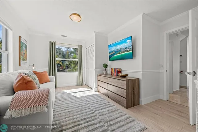 a bathroom with a granite countertop sink mirror vanity and a bathtub