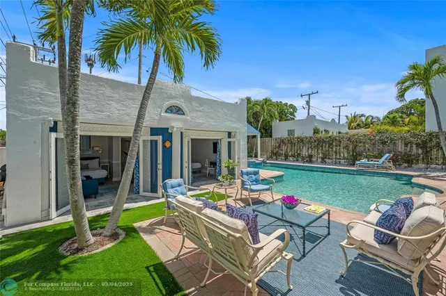 a spacious bedroom with a bed and a couch