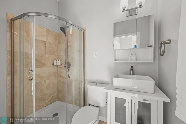 a view of a house with swimming pool and porch with furniture