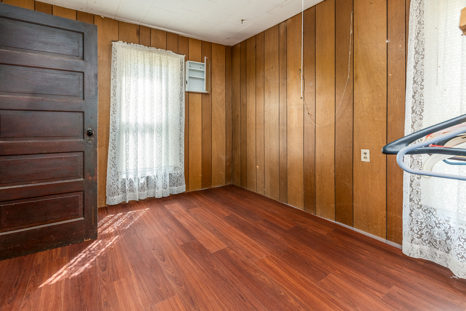 15016 Harmony Church Road West Frankfort, IL 62896 - Photo 15 of 31 a view of an empty room with wooden floor and a window