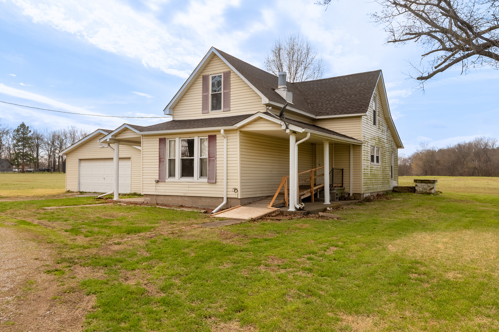 15016 Harmony Church Road West Frankfort, IL 62896 - Photo 2 of 31 a front view of a house with a garden and yard